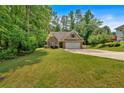 A well-maintained single-Gathering home with a brick facade and two-car garage sits on a spacious lot at 8166 N Pine Cone Dr, Villa Rica, GA 30180