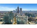 Expansive aerial view of the city skyline featuring modern high-rise buildings and colorful autumn trees at 855 Peachtree Ne St # 2812, Atlanta, GA 30308