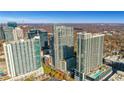 Impressive aerial view of high-rise apartments with city views, autumn trees, and private outdoor pools at 855 Peachtree Ne St # 2812, Atlanta, GA 30308