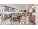 Finished basement with a bar area, game table, and entertainment space at 1438 Kings Park Nw Dr, Kennesaw, GA 30152