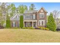 Charming two-story brick home with well-maintained landscaping and inviting curb appeal at 1438 Kings Park Nw Dr, Kennesaw, GA 30152