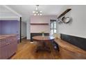 Bright dining area with built-in bench seating and a round wood table at 3650 Dogwood Farm Rd, Decatur, GA 30034