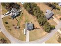 Aerial view of a home in a neighborhood with mature trees, a circular street, and large lots at 248 Christian Circle, Carrollton, GA 30116