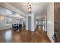 Elegant dining area with hardwood floors, modern lighting, and access to other areas of the home at 358 Southerland Ne Ter, Atlanta, GA 30307