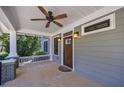 Charming front porch with ceiling fan, decorative lights, and a welcoming entrance at 358 Southerland Ne Ter, Atlanta, GA 30307