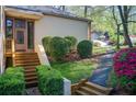 Inviting front entrance with a decorative door, manicured bushes and stone walkway at 4983 Odins Way, Marietta, GA 30068