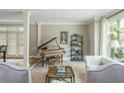 Elegant living room with a neutral color palette, lots of natural light, and stylish decor for comfortable living at 730 Denmead Se Ml, Marietta, GA 30067