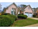 Charming single-story home featuring a well-manicured lawn, a two-car garage, and a welcoming entrance at 4103 Christacy Way, Marietta, GA 30066