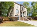 Brick home with a 2-car garage, complemented by lush landscaping and a well-maintained lawn at 3110 Dickson Ne St, Brookhaven, GA 30319