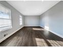 Spacious and bright living room with hardwood floors and natural light at 5211 Benjamin Trl, Ellenwood, GA 30294