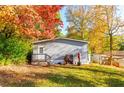 Home exterior showing a spacious backyard and a well-maintained yard at 7024 Evergreen Way, Buford, GA 30518