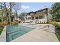Inviting backyard with a swimming pool and spa, perfect for relaxation and entertainment at 1068 Moores Mill Nw Rd, Atlanta, GA 30327