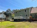 The rear exterior features neutral siding, a wooden deck, and a storage shed at 728 Slew Ave, Lawrenceville, GA 30043
