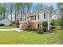 Charming two-story home with mature trees surrounding the landscaped yard at 1160 Chateau Ter, Mcdonough, GA 30253