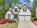 Charming two-story home with manicured landscaping and a two-car garage at 2015 Chelton Se Way, Smyrna, GA 30080