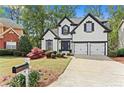 Attractive two-story home featuring a well-maintained lawn and a two-car garage at 2015 Chelton Se Way, Smyrna, GA 30080