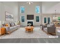 Bright living room features a cozy fireplace, high ceilings and plentiful windows that provide natural light at 3110 Cambrian Ter, Austell, GA 30106
