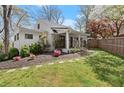 Charming home with a manicured lawn, beautiful landscaping, and fenced yard at 2870 Ridgemore Nw Rd, Atlanta, GA 30318