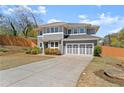 Well-maintained home featuring gray siding, a spacious driveway, and a neatly landscaped front yard at 1903 River Birch Ln, Atlanta, GA 30316