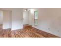 Open foyer area showcasing hardwood floors and natural light from a nearby window at 3987 Bayside Cir, Atlanta, GA 30340