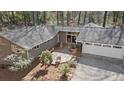 Aerial view of a home showcasing its roof, deck, and surrounding landscape at 2724 Janellen Dr, Atlanta, GA 30345