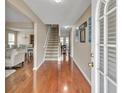 Bright entryway showcasing gleaming hardwood floors and an inviting staircase leading to upper levels at 4145 Alveston Dr, Atlanta, GA 30349