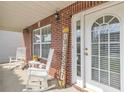 Charming front porch with rocking chairs and a decorative 'Blessed' sign, offering a warm welcome at 4145 Alveston Dr, Atlanta, GA 30349