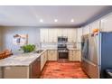 Kitchen with stainless steel appliances, granite countertops, and lots of cabinet space at 515 Roland Manor Dr, Dacula, GA 30019