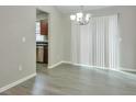 Dining area adjacent to kitchen, showcasing modern lighting and sliding glass doors for natural light at 2463 Corner Shoals Dr, Decatur, GA 30034