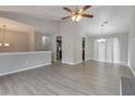 Open-concept space with updated lighting and vaulted ceilings, seamlessly blending dining and living at 2463 Corner Shoals Dr, Decatur, GA 30034