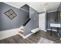 Inviting entryway with hardwood floors, modern decor, and staircase leading to upper level at 4306 Thorngate Ln, Acworth, GA 30101