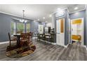 Open concept kitchen and dining area featuring stainless steel appliances and modern finishes at 4306 Thorngate Ln, Acworth, GA 30101