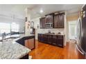 Kitchen with granite countertops, stainless steel appliances, and abundant cabinet space at 7514 Absinth Dr Pass, Atlanta, GA 30349