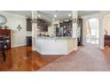 Spacious kitchen featuring granite countertops, dark cabinetry, and an open design at 7514 Absinth Dr Pass, Atlanta, GA 30349