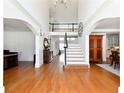 Spacious foyer with hardwood floors, staircase, and high ceilings at 3230 Munsey Ct, Cumming, GA 30041