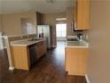 Well-equipped kitchen with stainless steel appliances and bright countertops at 3615 Hutchinson Trace Dr, Cumming, GA 30040