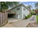 Back exterior featuring a wood deck, backyard, and driveway providing convenient parking at 638 Cooledge Ne Ave, Atlanta, GA 30306