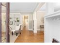 Inviting foyer with hardwood floors, built-in shelving and views into other living spaces at 638 Cooledge Ne Ave, Atlanta, GA 30306