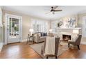 Cozy living room showcasing hardwood floors, fireplace and lots of natural light at 638 Cooledge Ne Ave, Atlanta, GA 30306