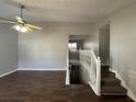 Spacious living room with staircase, hardwood floors, and natural light at 120 Grove Ln, Temple, GA 30179