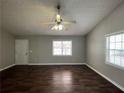 Bright living room featuring a ceiling fan, hardwood floors and natural light at 120 Grove Ln, Temple, GA 30179