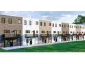 Rear view of townhouses with private balconies, brick accents, and well-maintained green space at 345 Sugarview Rd, Sugar Hill, GA 30518