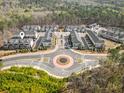 An aerial view showcases the neighborhood layout and surrounding green space at 2020 Rivermont Way, Roswell, GA 30076