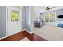 Cozy living room featuring a comfortable gray sofa, hardwood floors and bright natural light at 429 Argonne Ter, Canton, GA 30115