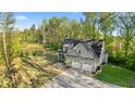 Gorgeous view of the home, backyard, and private pond at 2442 Lower Union Hill Rd, Canton, GA 30115
