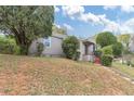 One story home showcasing the side yard, lush greenery, and cozy residential setting at 1679 Sw Lisbon Sw Dr, Atlanta, GA 30310