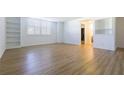 Bright living room with built-in bookshelves and a view into the bathroom at 2965 Pharr Court South Nw # 503, Atlanta, GA 30305