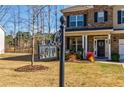 Street view of a two-story home, showcasing the house number, front yard, and well-kept landscaping at 4870 Odum View Ln, Cumming, GA 30040