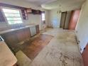 Kitchen showcasing dated cabinets, laminate countertops, and a stainless steel dishwasher at 103 Woodhaven Dr, Stockbridge, GA 30281