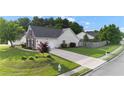 Traditional style home with brick and vinyl siding, attached garage, and landscaped yard at 2650 Hamilton Chase Run, Buford, GA 30519